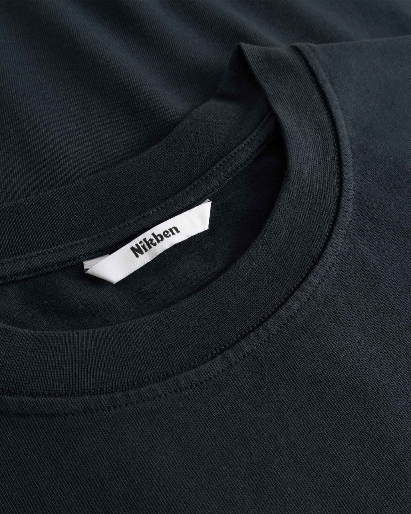 Black t-shirt with a Nikben label on the collar