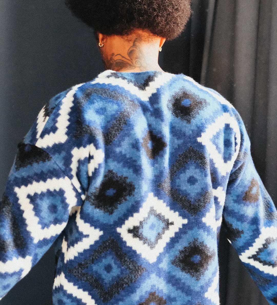 Back of blue and white diamond Ikat patterned cardigan
