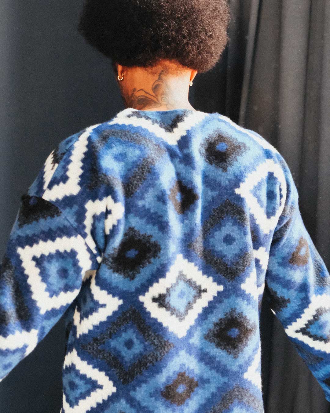 Back of blue and white diamond Ikat patterned cardigan