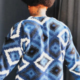 Back of blue and white diamond Ikat patterned cardigan
