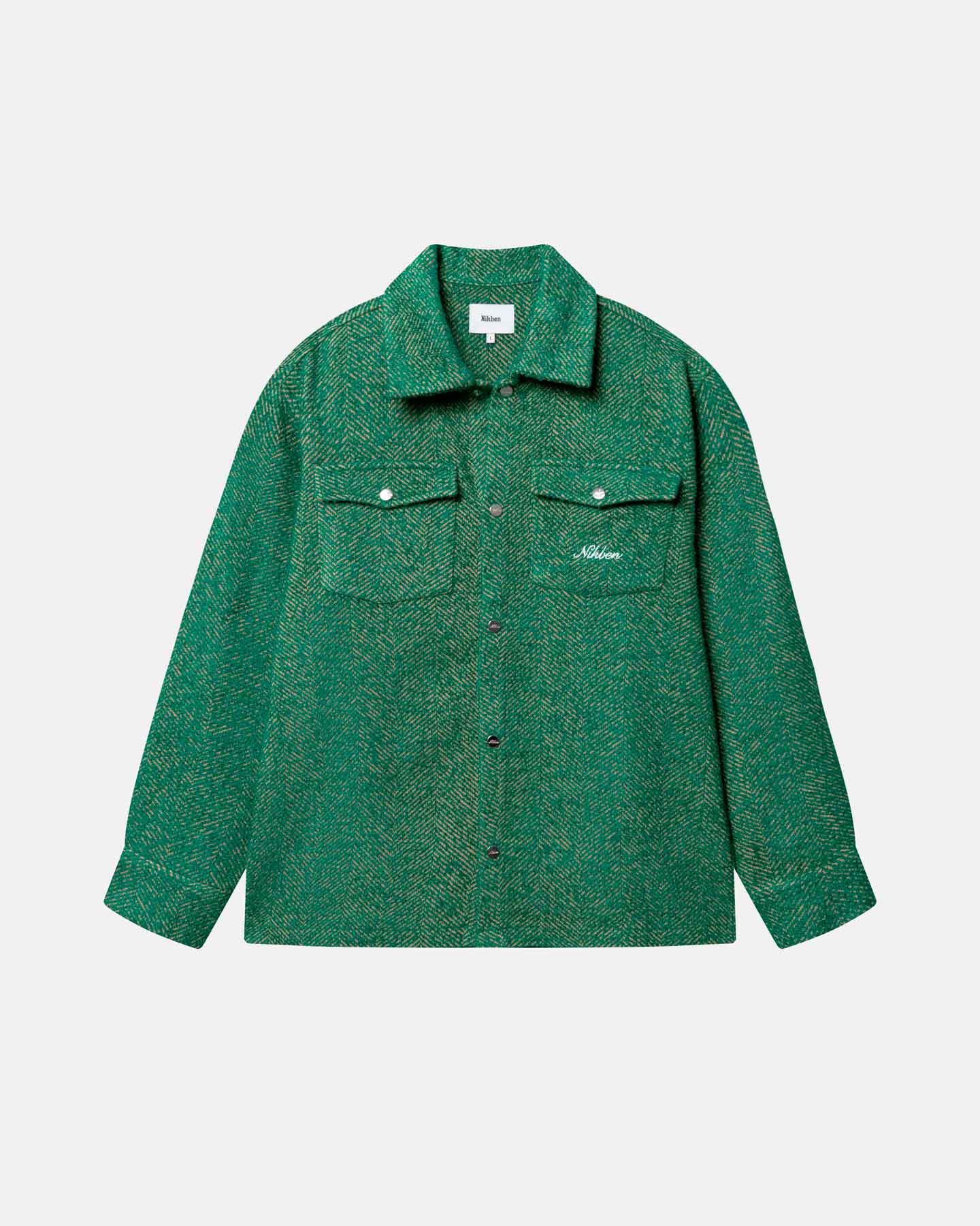 Green hemmingbone patterned shirt with two button down breast pockets, small logo in white on a pocket.