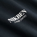 Closeup on white Nikben logo on black T-shirt