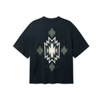 Back of black T-shirt with native inspired print in green, white and black
