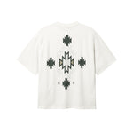 Back of white T-shirt with native inspired print in green and white