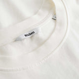 Closeup view of Nikben necklabel on white T-shirt