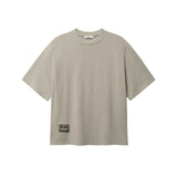 Beige T-shirt with green Nikben patch logo on the lower left side 