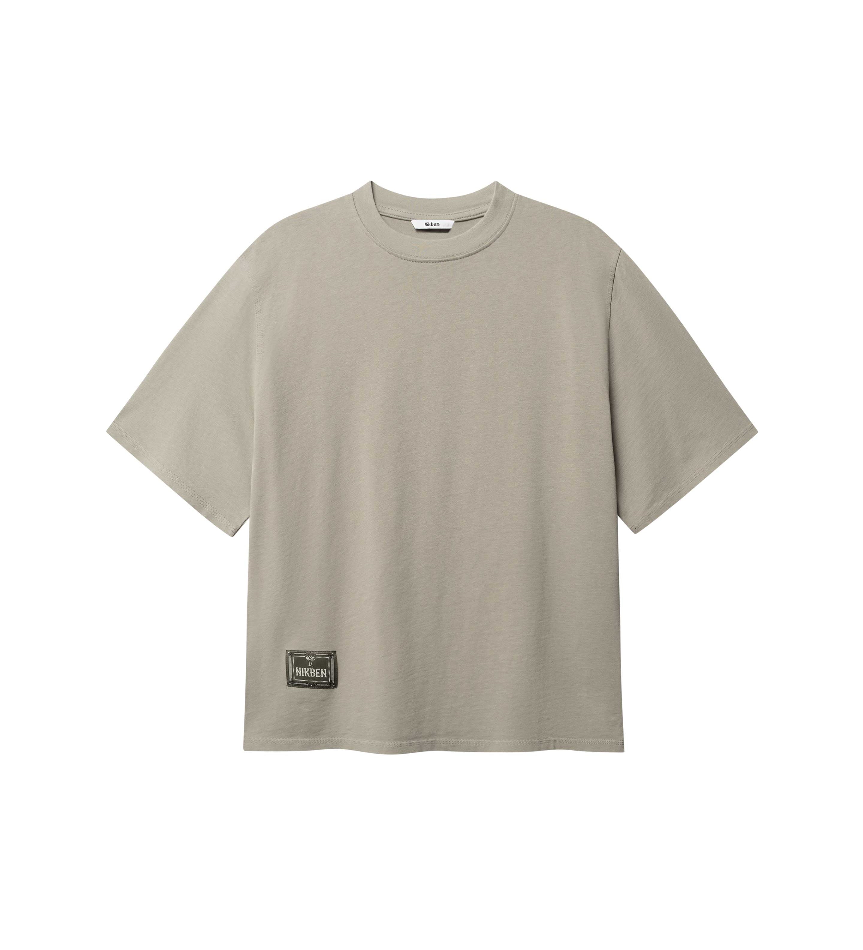 Beige T-shirt with green Nikben patch logo on the lower left side 