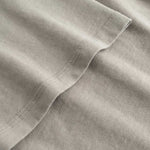 Closeup view of arm stitchings on beige T-shirt