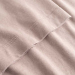 Closeup view of arm stitchings on beige T-shirt