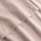 Closeup view of arm stitchings on beige T-shirt
