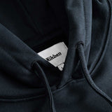 Closeup view of Nikben necklabel on black hoodie
