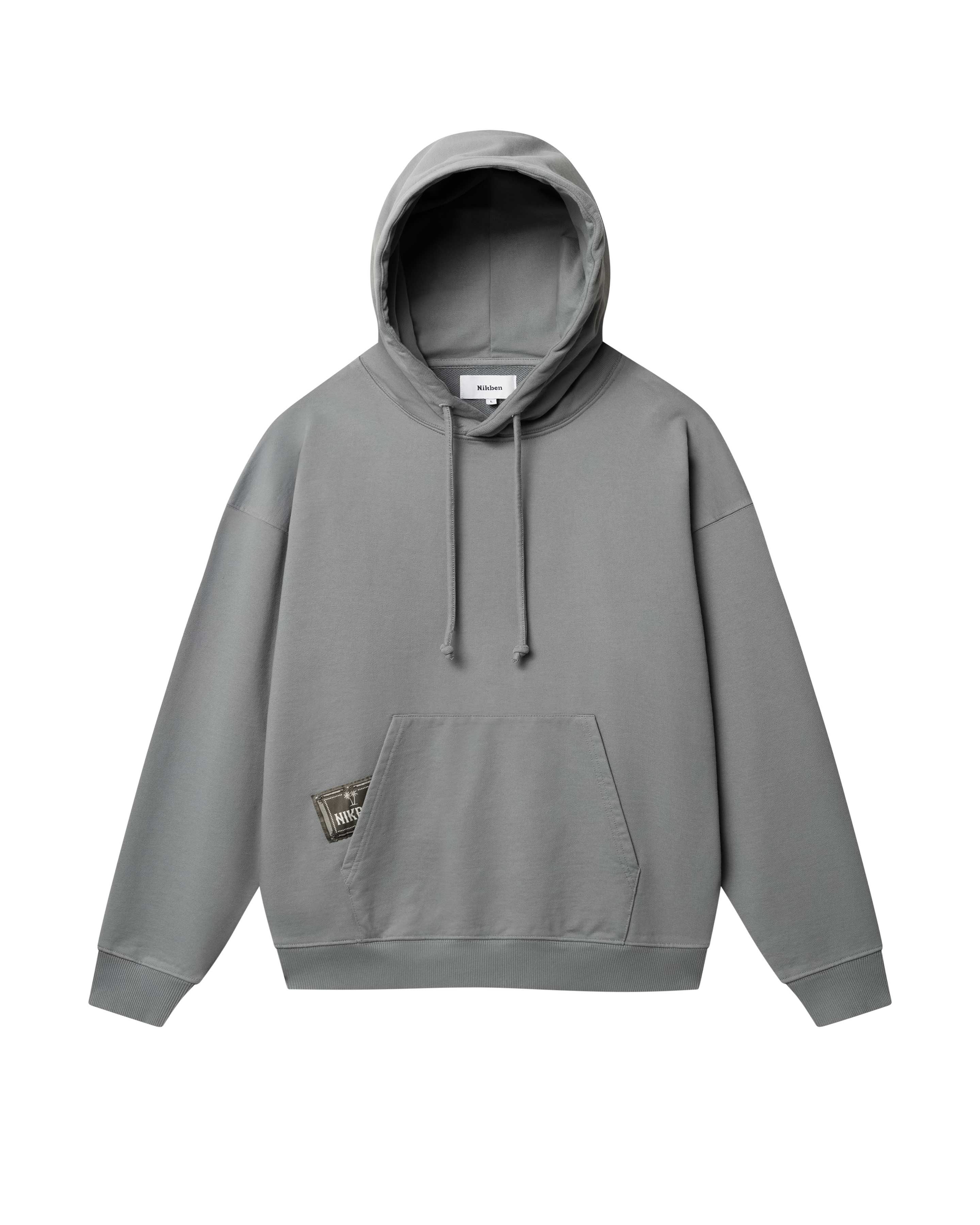 Grey hoodie with green Nikben patch label next to left pocket 