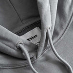 Closeup view of Nikben necklabel on grey hoodie