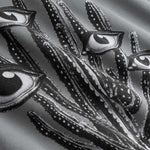 Closeup view of black and white cactus print on grey hoodie