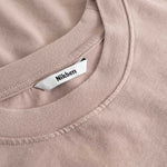 Closeup view of Nikben necklabel on brown T-shirt