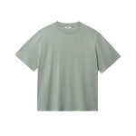 Green T-shirt with brown "BUENAS NOCHES" text print on chest