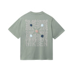 Green T-shirt with "NIKBEN" text and blue, brown and beige graphic print on the back