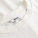 Closeup view of Nikben necklabel on white T-shirt