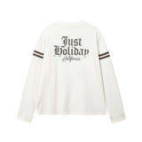 White longsleeve T-shirt with brown "JUST HOLIDAY" print on back and brown stripes on sleeves