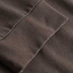 Closeup view of cuffs on brown longsleeve T-shirt