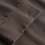 Closeup view of cuffs on brown longsleeve T-shirt