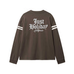 Brown longsleeve T-shirt with white "JUST HOLIDAY" print on back and white stripes on sleeves