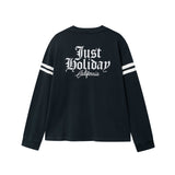 Black longsleeve T-shirt with white "JUST HOLIDAY" print on back and white stripes on sleeves