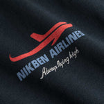 Closeup view of blue Nikben Airlines logo and red airplane print on black T-shirt