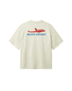 Back of light grey T-shirt with blue Nikben Airlines logo and red airplane print 