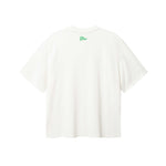 Back of white T-shirt with green flag print on the neck