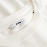 Closeup view of Nikben necklabel on white T-shirt