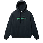 Black hoodie with green "TOURIST" print on the middle chest