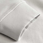 Closeup view of ribbed cuff on gray hoodie