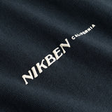 Closeup view of white "Nikben California" logo on black T-shirt