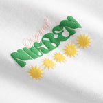 Closeup view of multicolored Nikben logo on white T-shirt