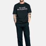 Male model wearing a black t-shirt with "no rain no flowers" felt letters