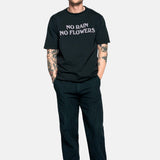 Male model wearing a black t-shirt with "no rain no flowers" felt letters