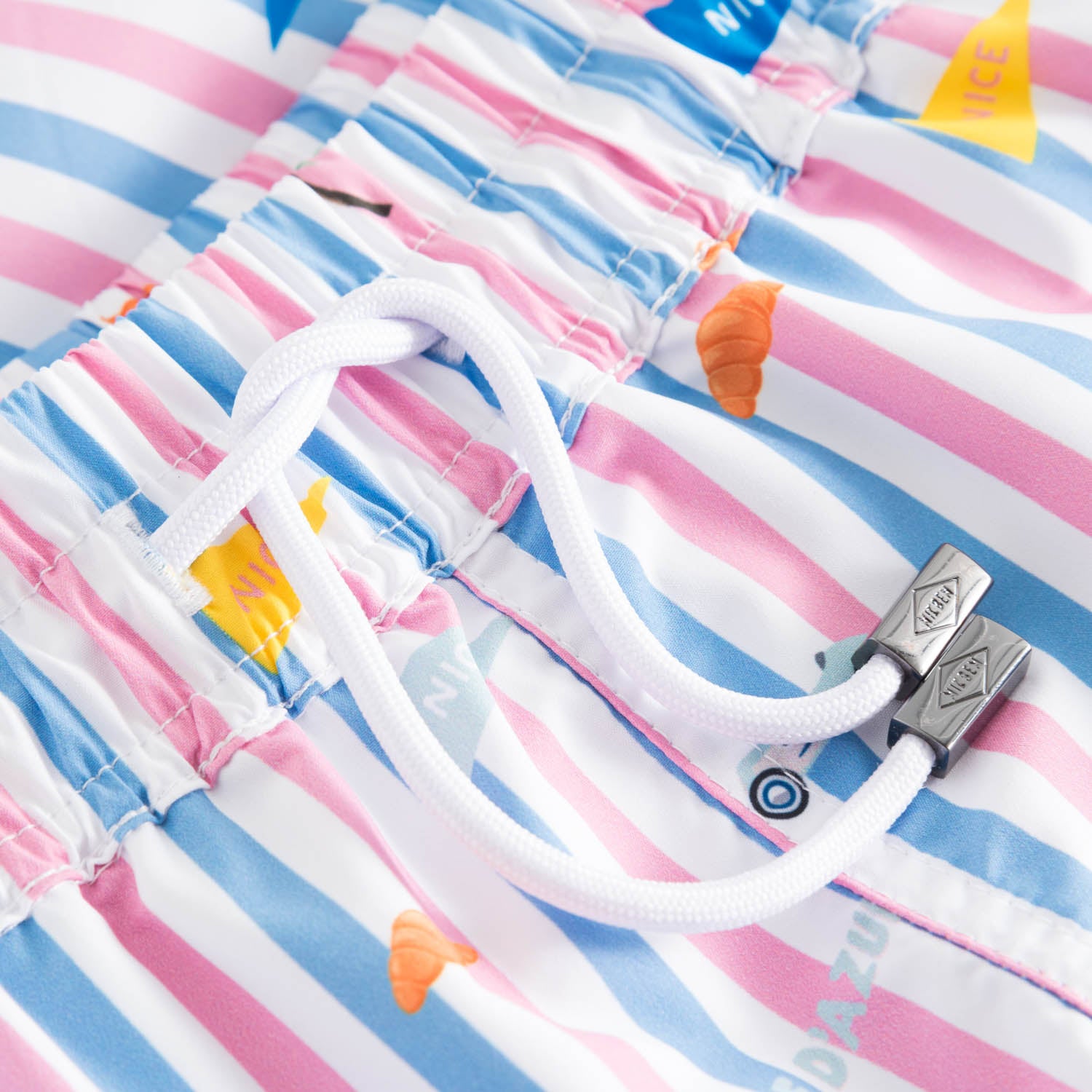 Drawstring on blue, pink and white striped swimtrunks