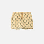 Beige swim trunks with leopard pattern print. Mid length shorts with drawstring waistband and two side pockets.