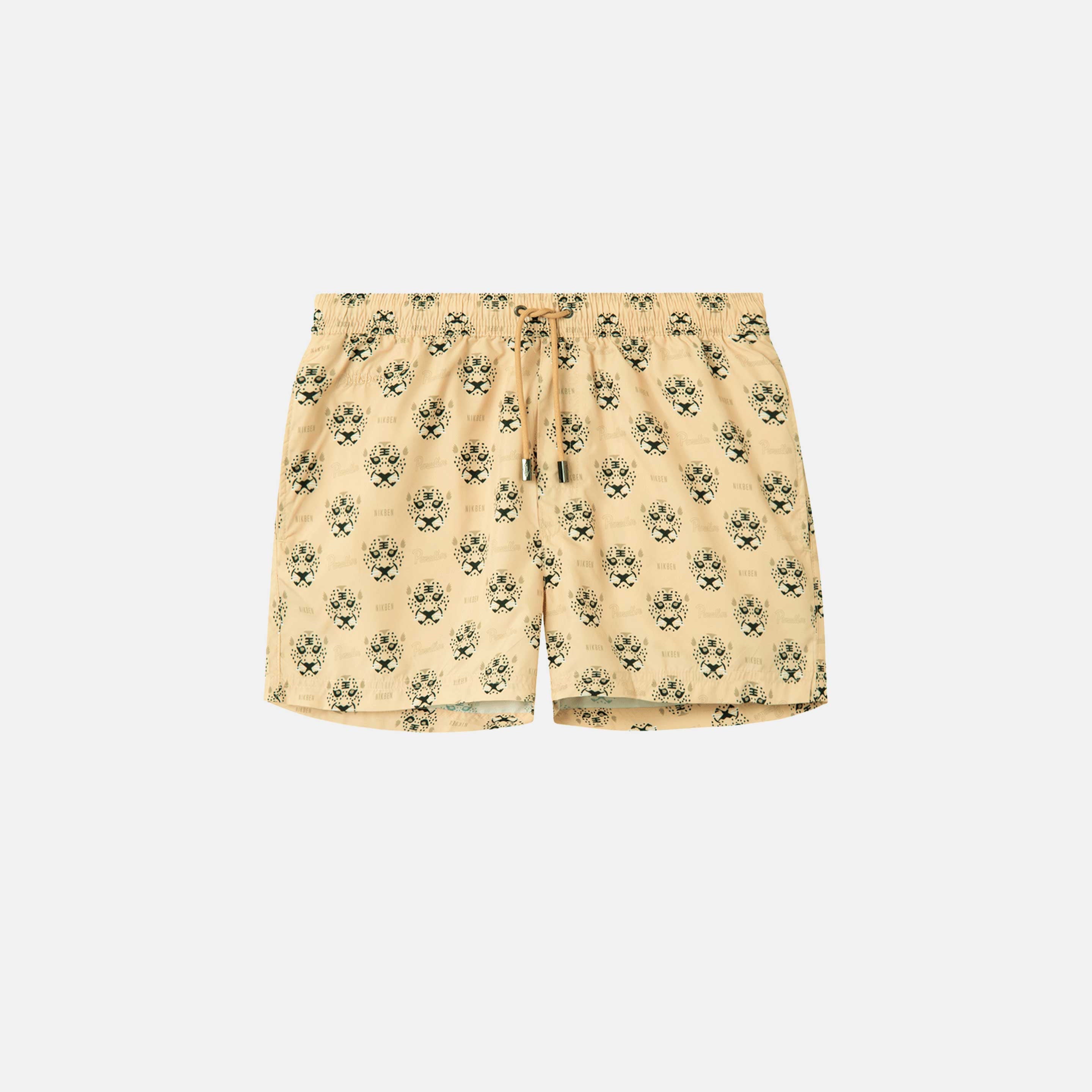 Beige swim trunks with leopard pattern print. Mid length shorts with drawstring waistband and two side pockets.