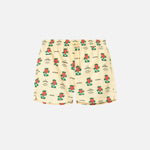 Off white swim trunks with strawberries and text