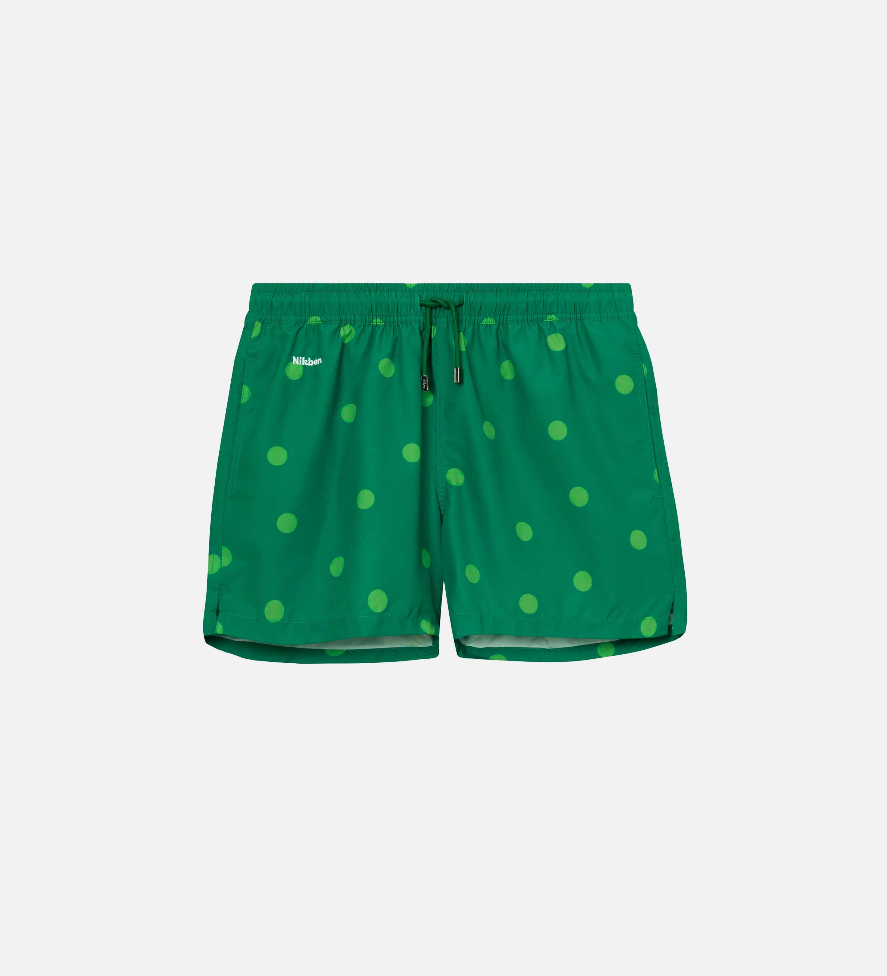 Green swim trunks with light green dots print. Mid length shorts with drawstring waistband and two side pockets.
