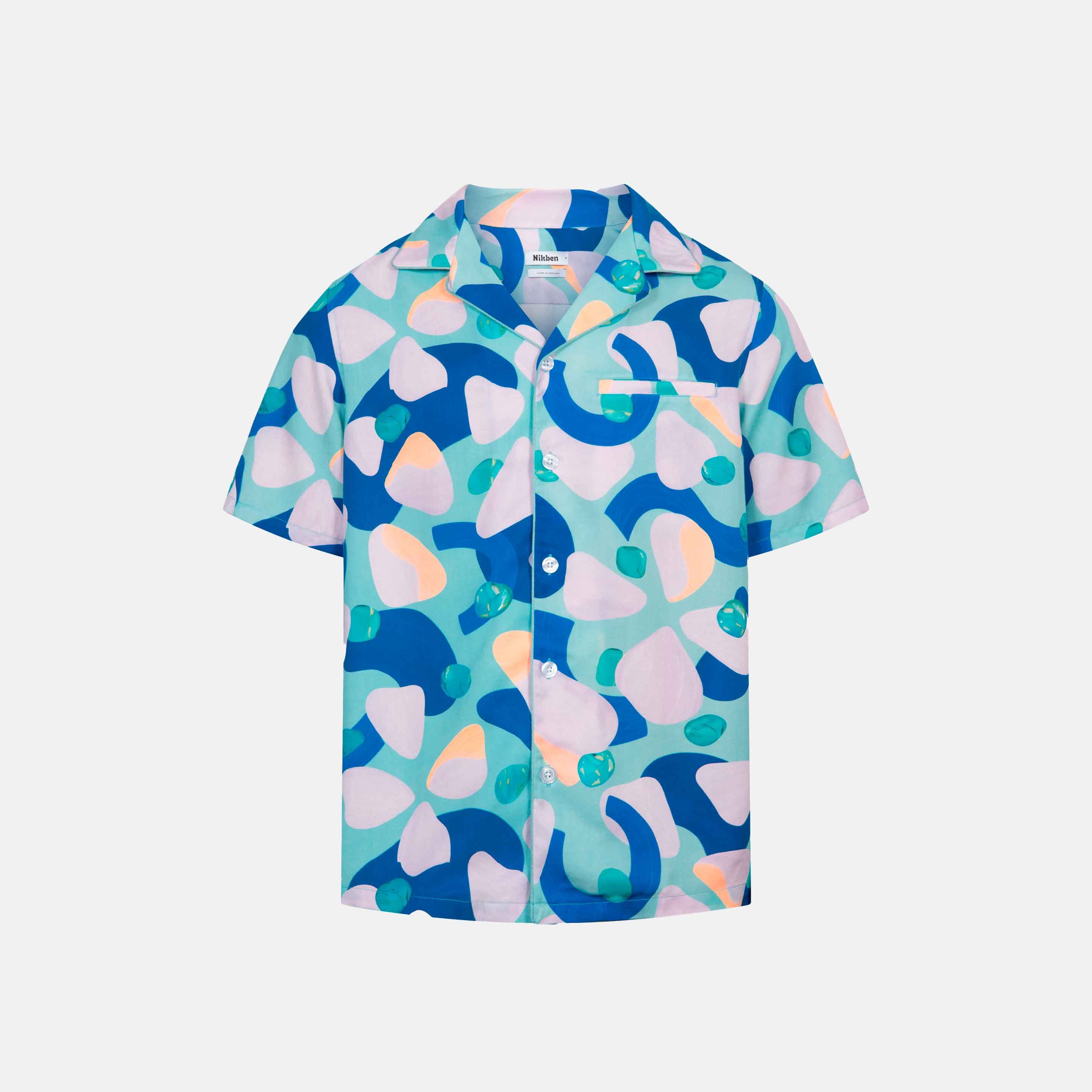 Short-sleeved vacation shirt with a multi-colored graphic patter, open collar, one breast pocket, and button closure.