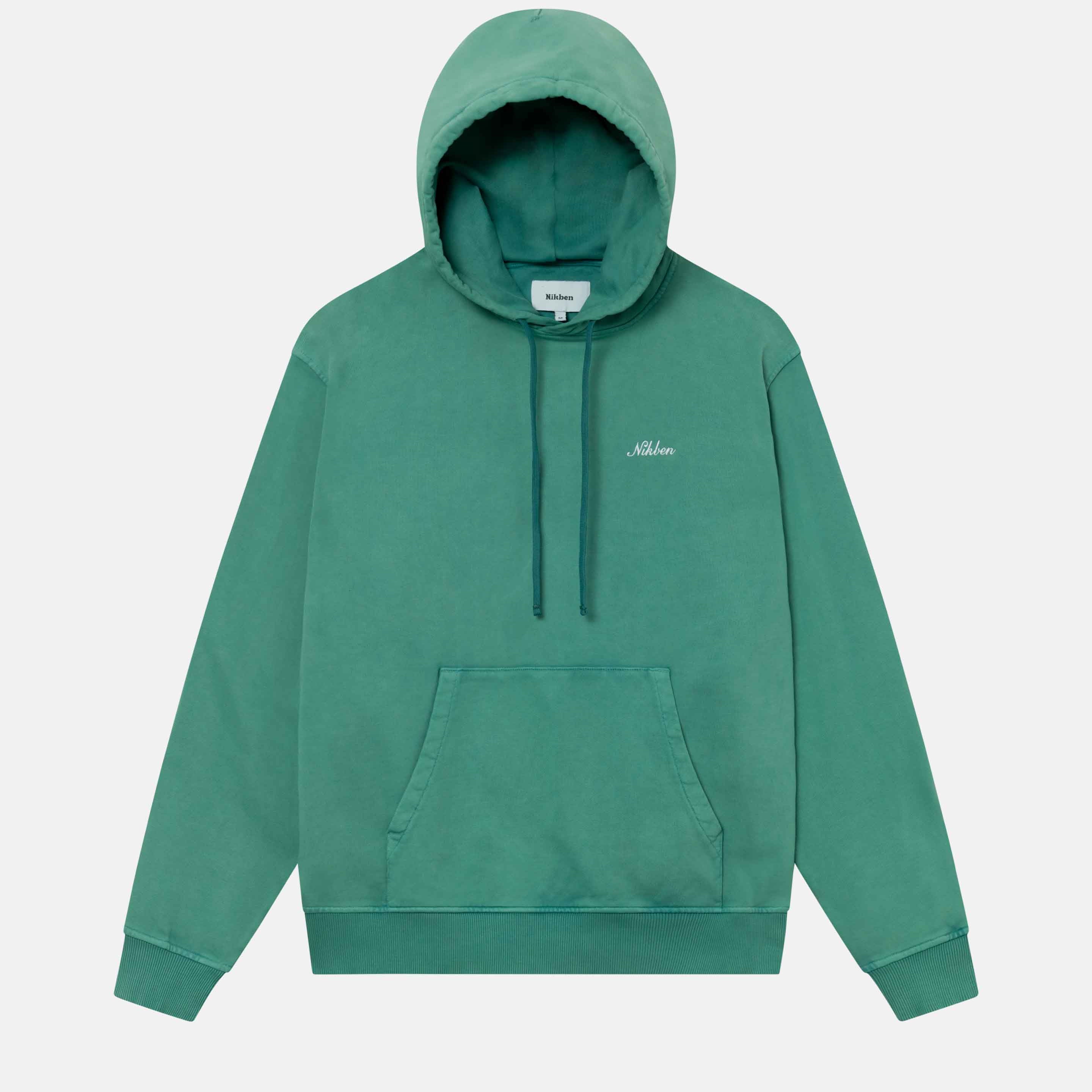 A green hoodie with an embroidered Nikben script logo