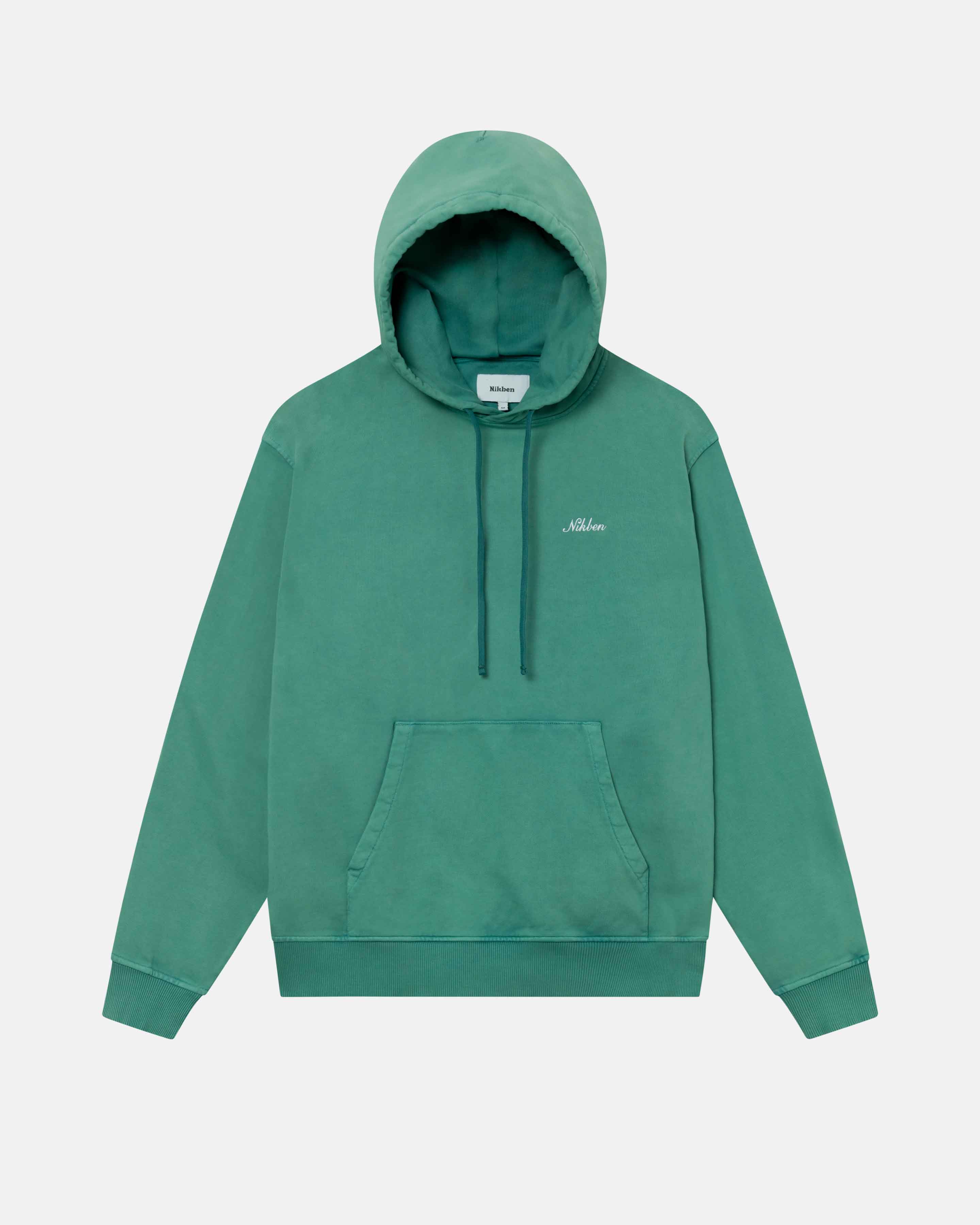 A green hoodie with an embroidered Nikben script logo