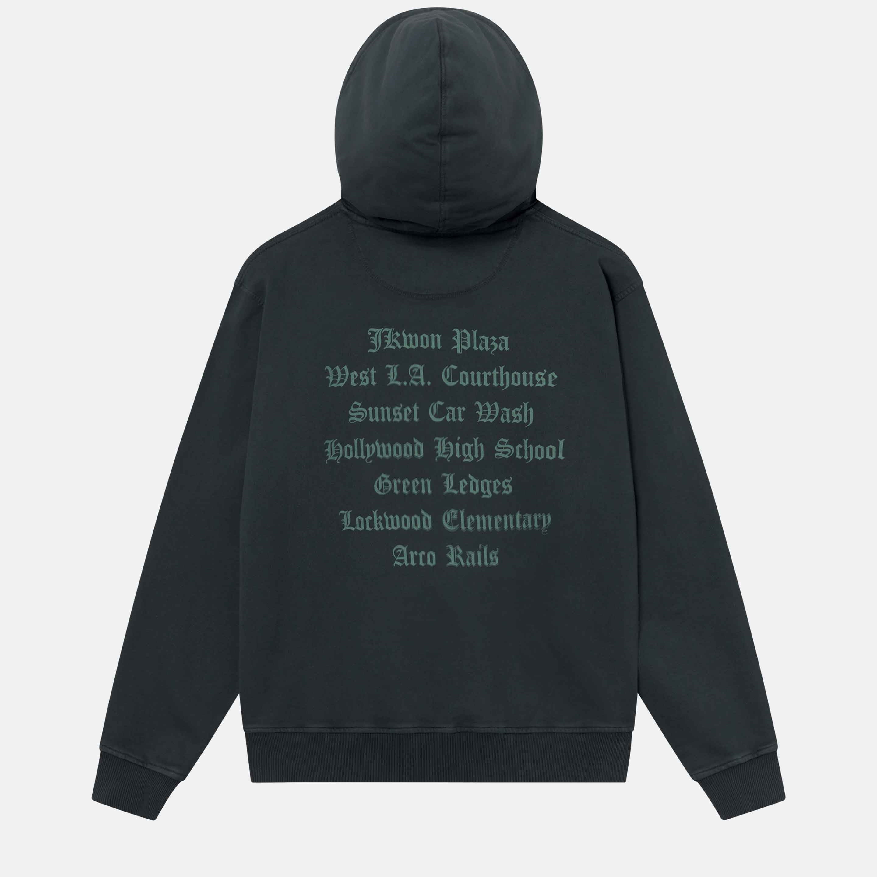 A black hoodie with a large green text print on its back