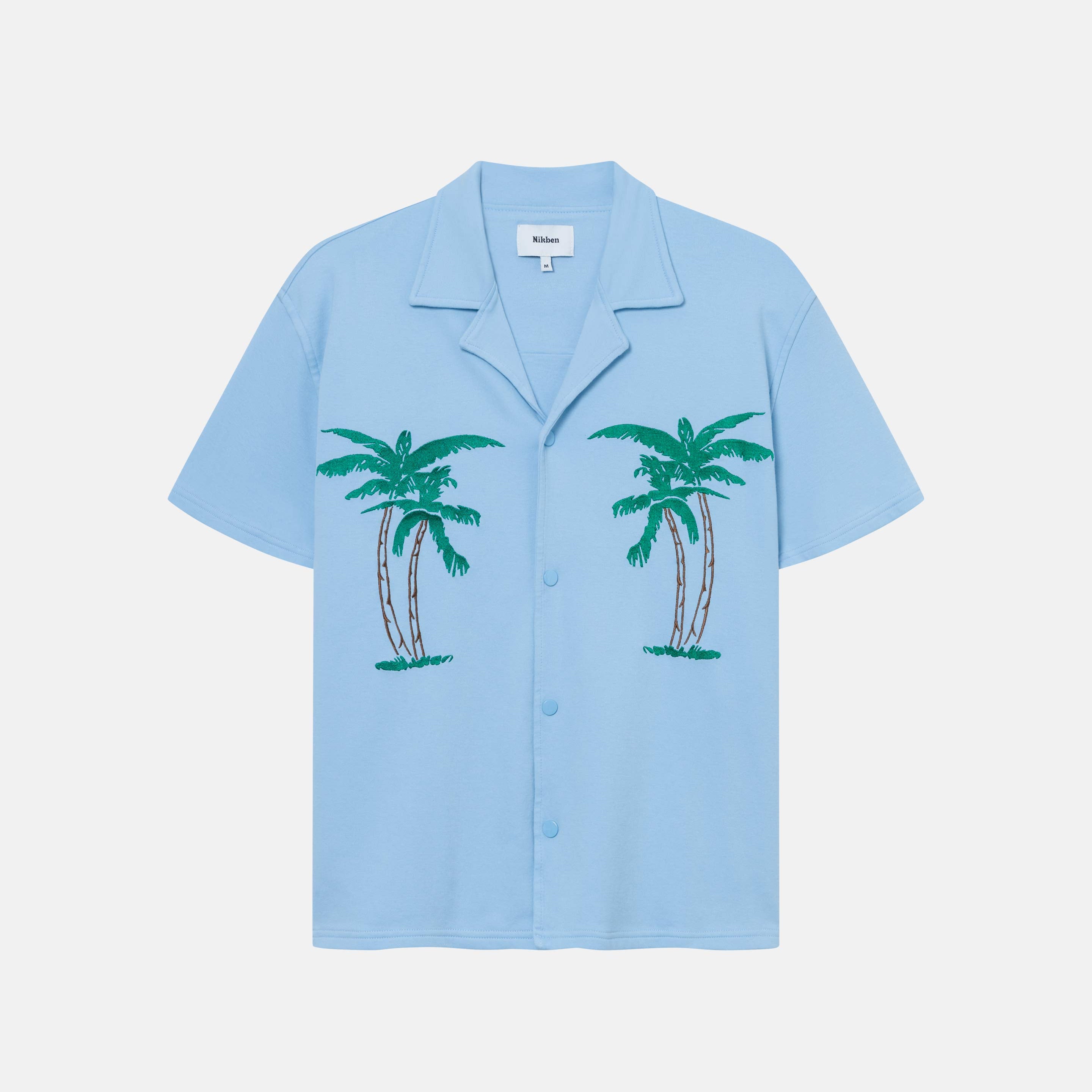 Sky blue short-sleeved shirt with palm tree embroidery