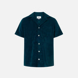 Navy blue short sleeve shirt with white button closure and one chest pocket