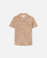 Light brown short sleeve shirt with white button closure and one chest pocket