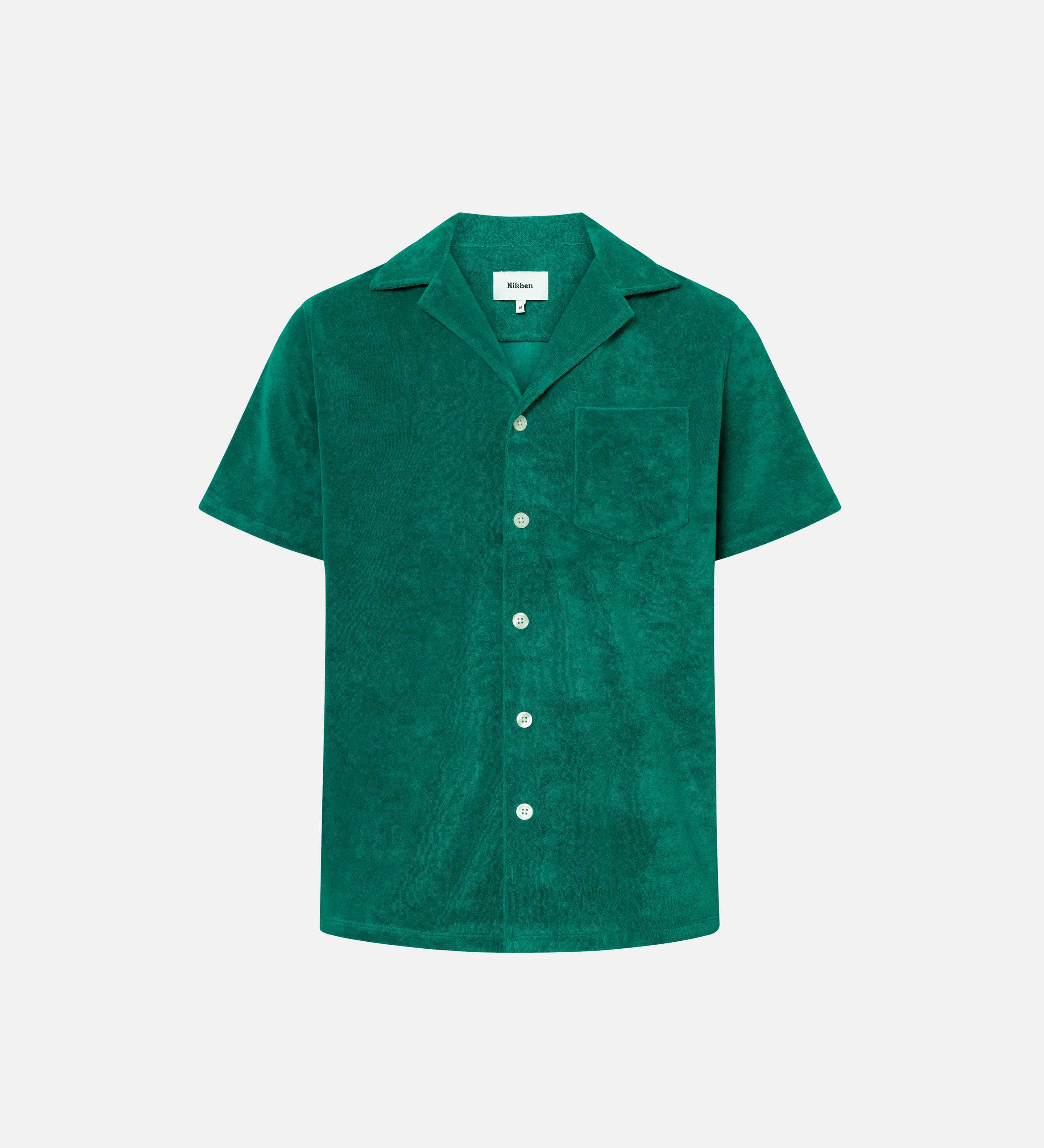Green short sleeve shirt with white button closure and one chest pocket